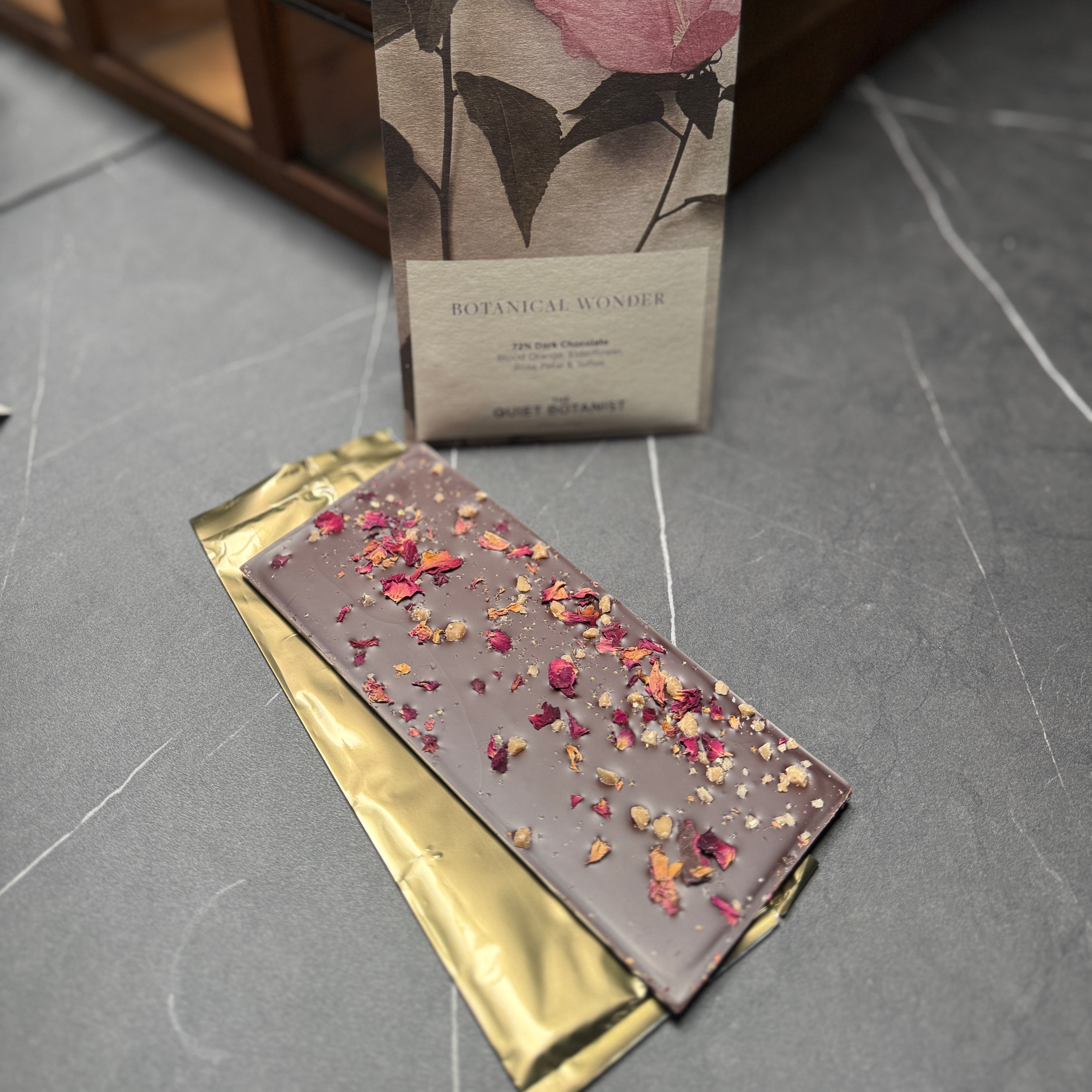 Artsan dark chocolate bar with rose petal, elderflower, blood orange, and toffee
