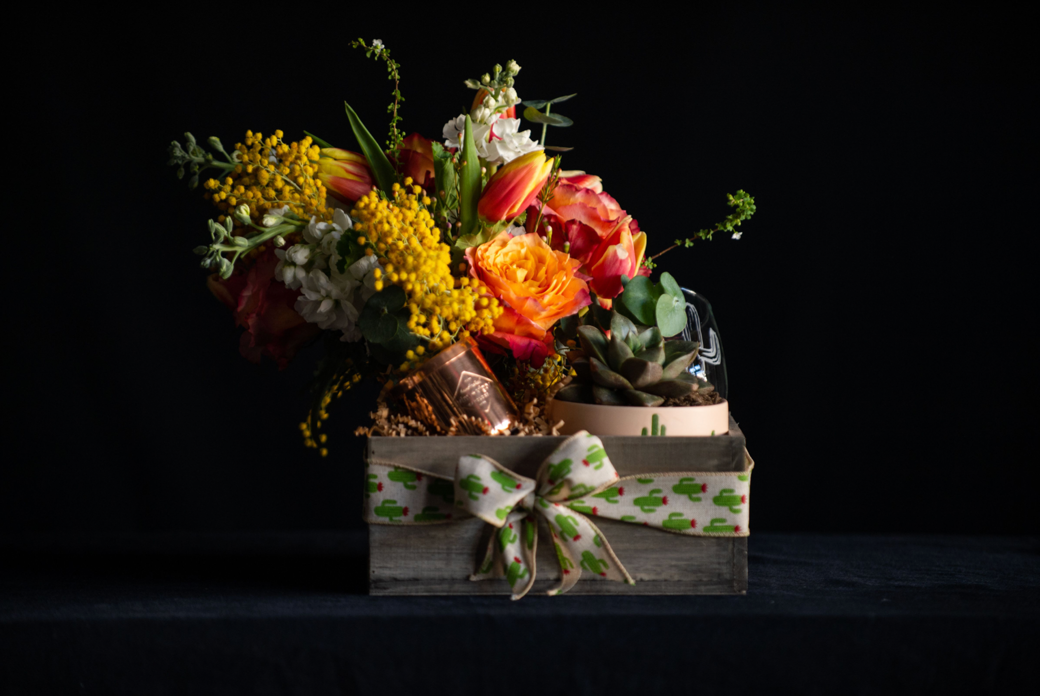 Curated gifts with local products, flowers, and plants created by a local flower shop