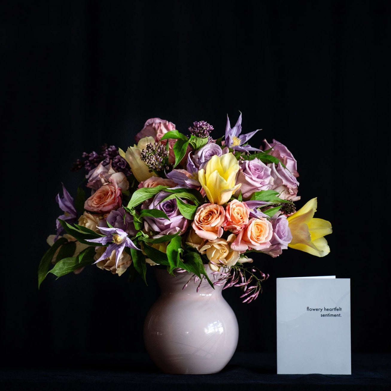 Mother's Day Flower son roses, tulips and season stems in lilac and peach tones