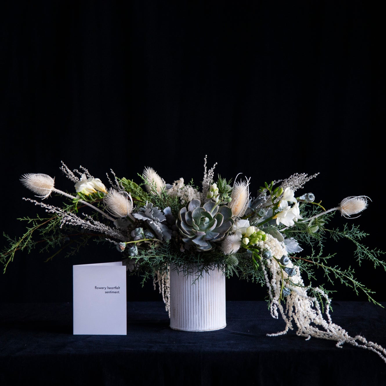 dusty white winter centerpiece