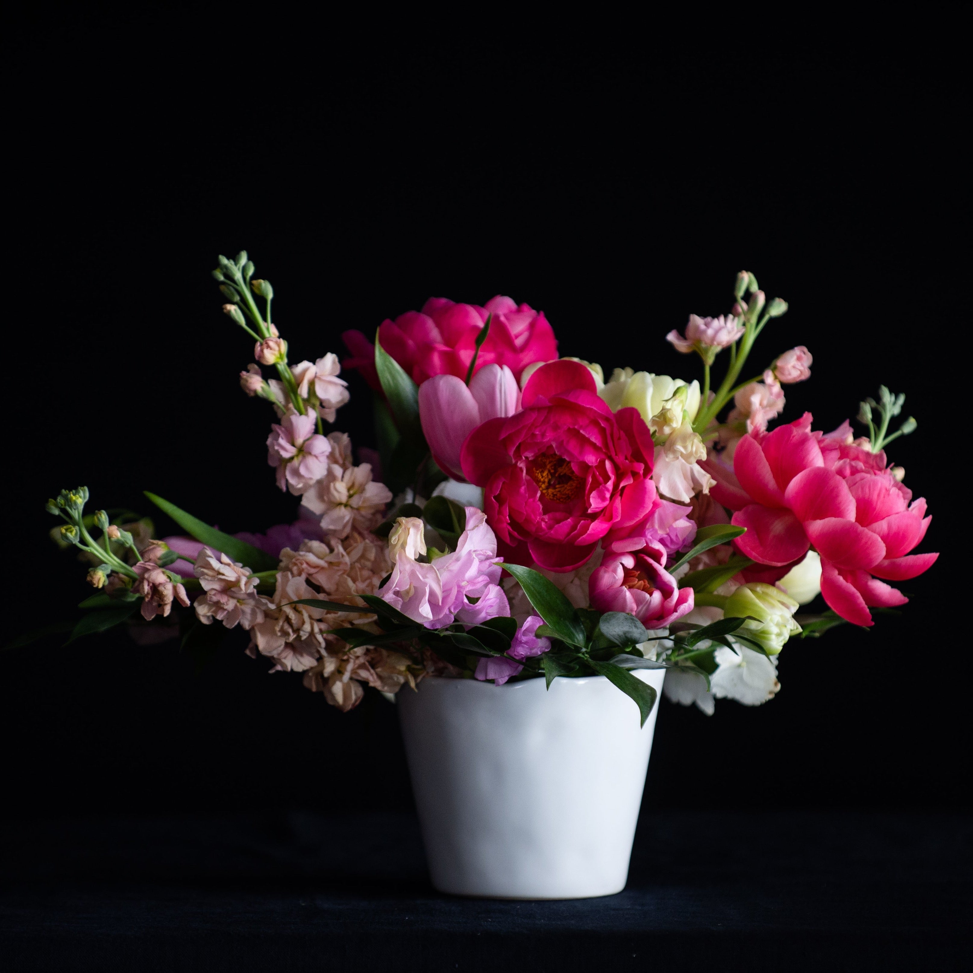 Peonies, tulips, hydrangea, and stock in pinks for Spring flowers