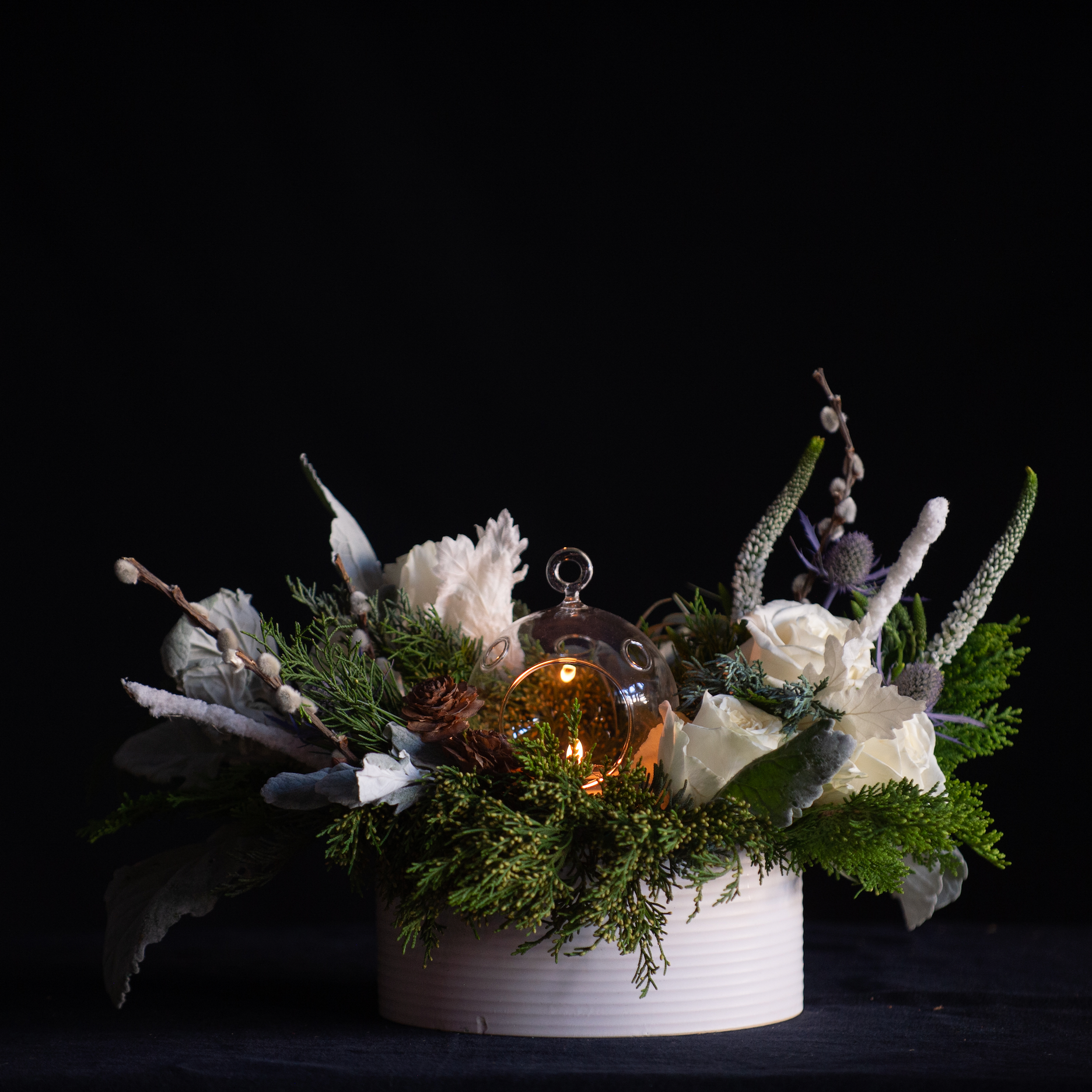 candlelit white holiday centerpiece