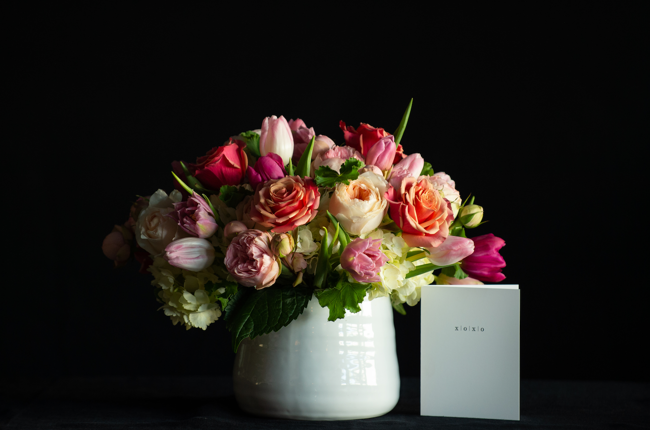 A dozen garden roses with hydrangea, roses and tulips for Valentine's Day made by a local florist