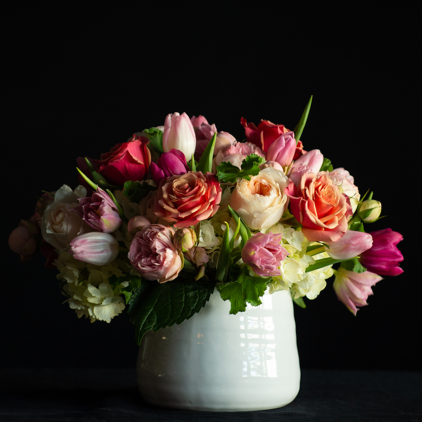 A dozen garden roses with hydrangea, roses and tulips for Valentine's Day made by a local florist
