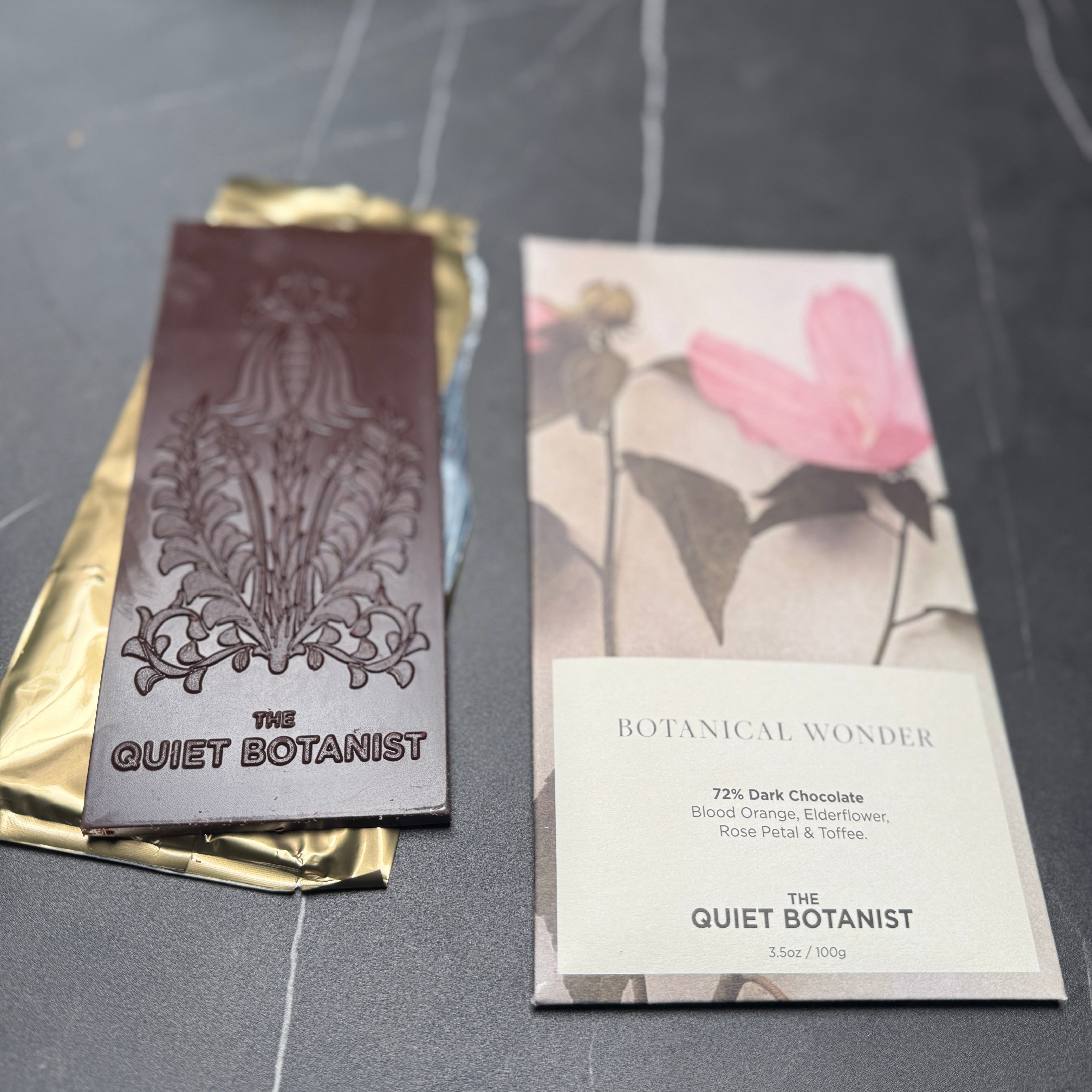 Artsan dark chocolate bar with rose petal, elderflower, blood orange, and toffee