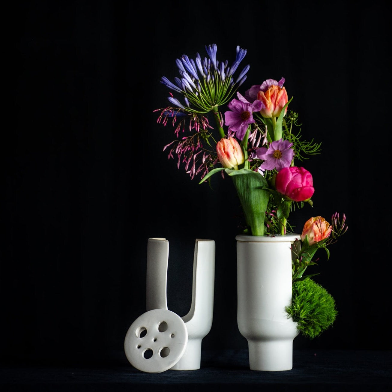 Mother's Day flowers in a modern architectural vase with a flower frog top. 