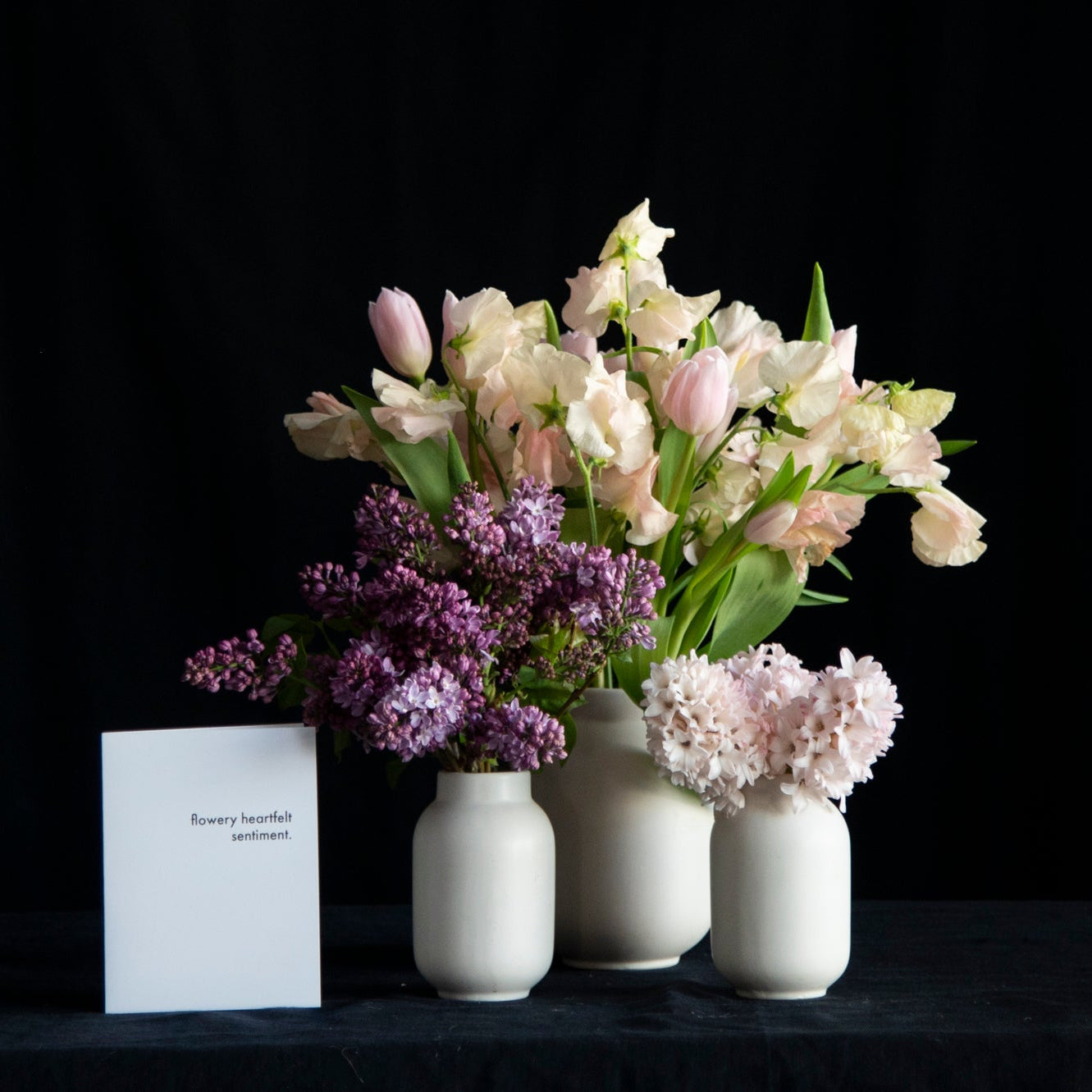 trio of vases filled with fragrant stems