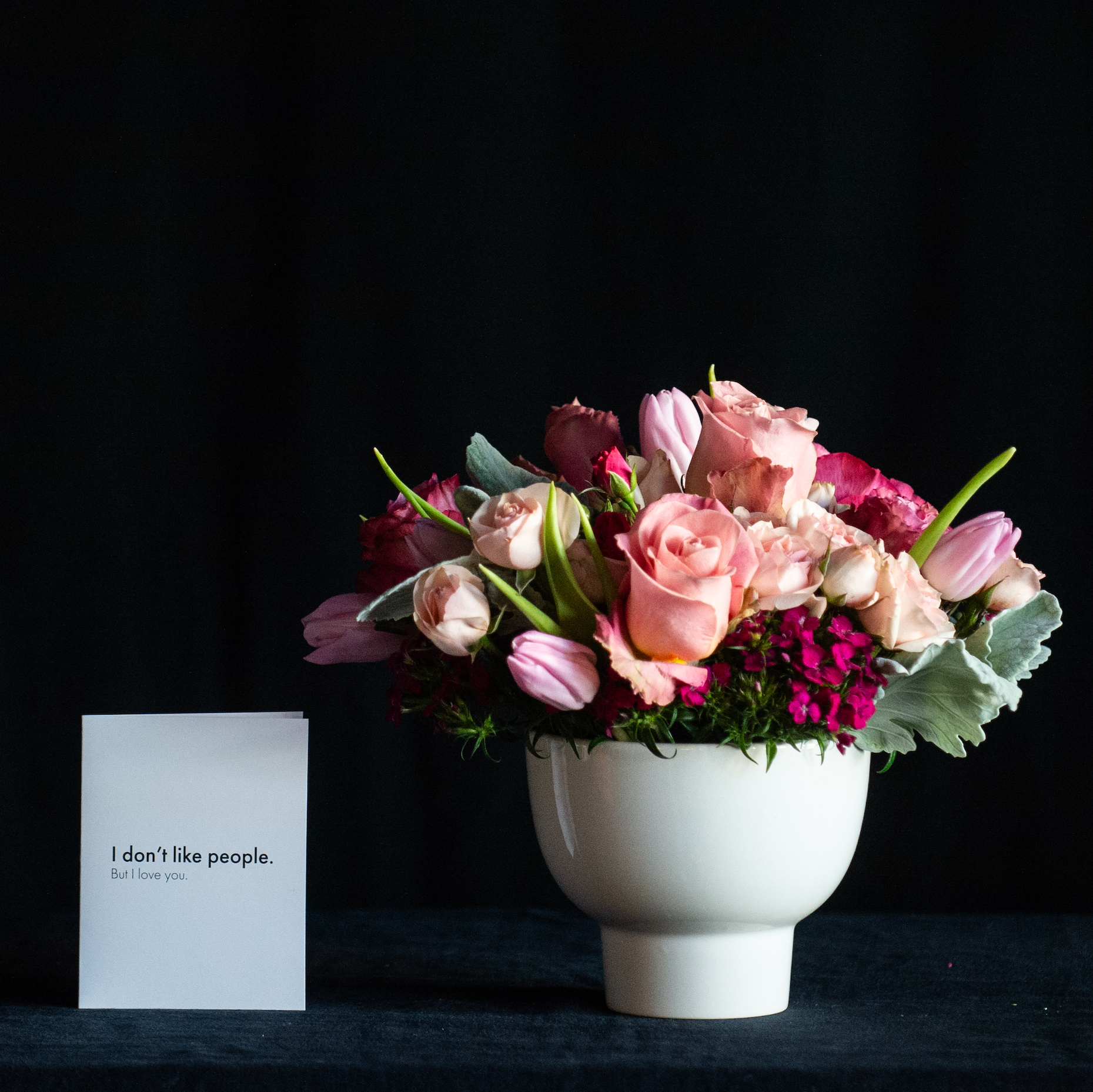 Pink Flowers for valentines day in a white ceramic vase