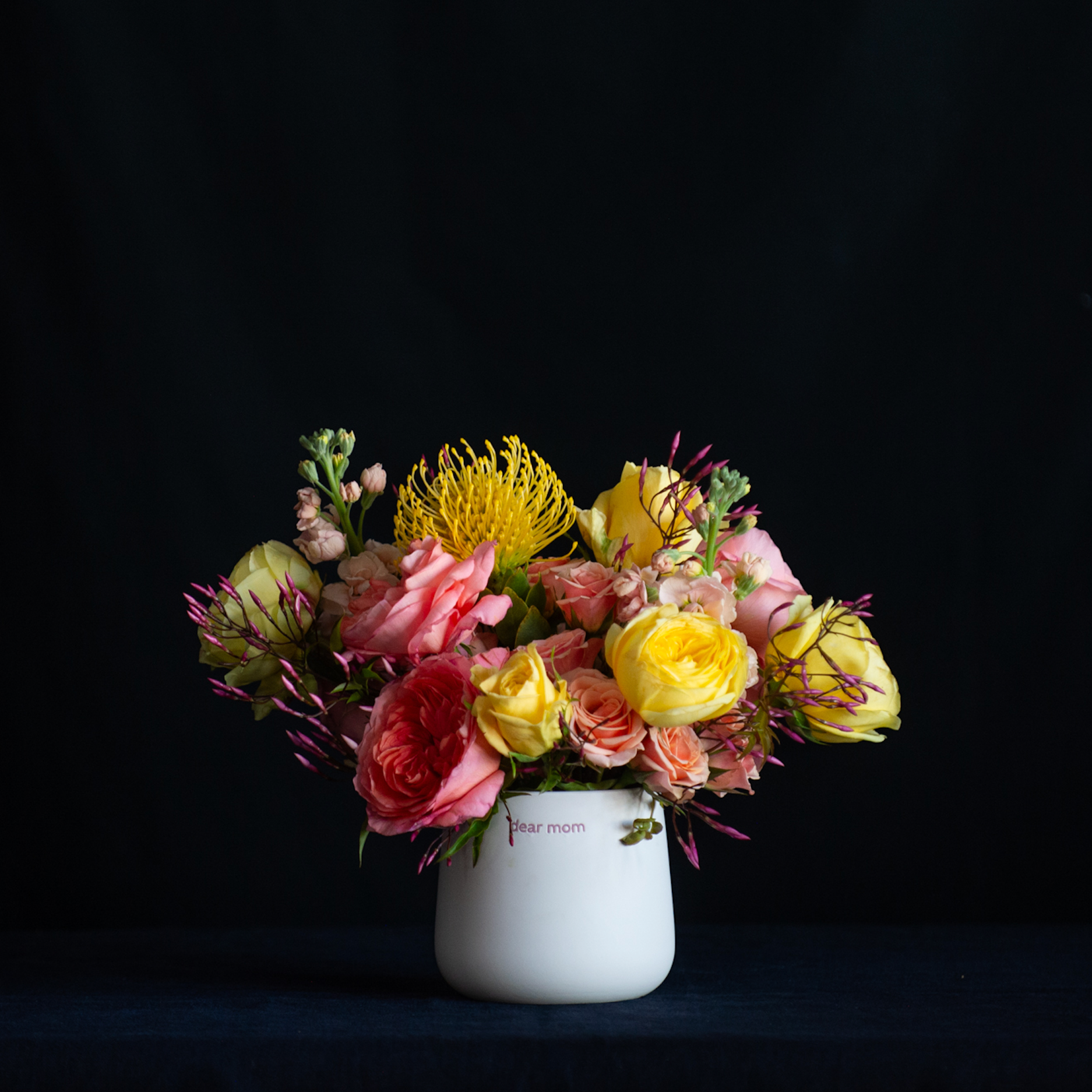 Mother's Day flowers in a vase that says "dear mom good job I turned out perfectly"