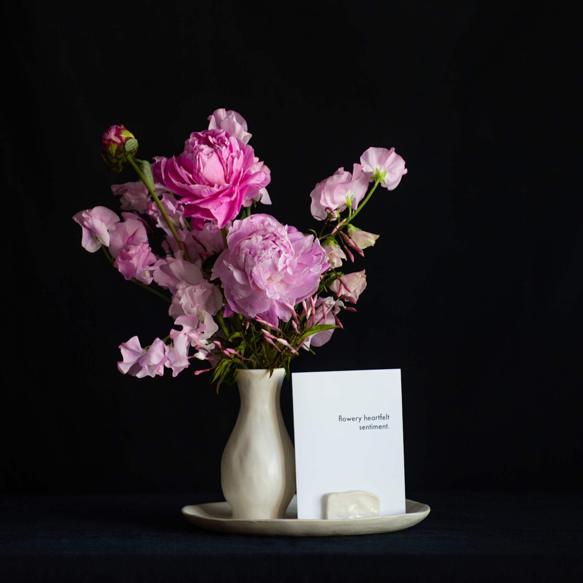 Mother's Day bud vase filled with peonies and sweet peas and a card holder
