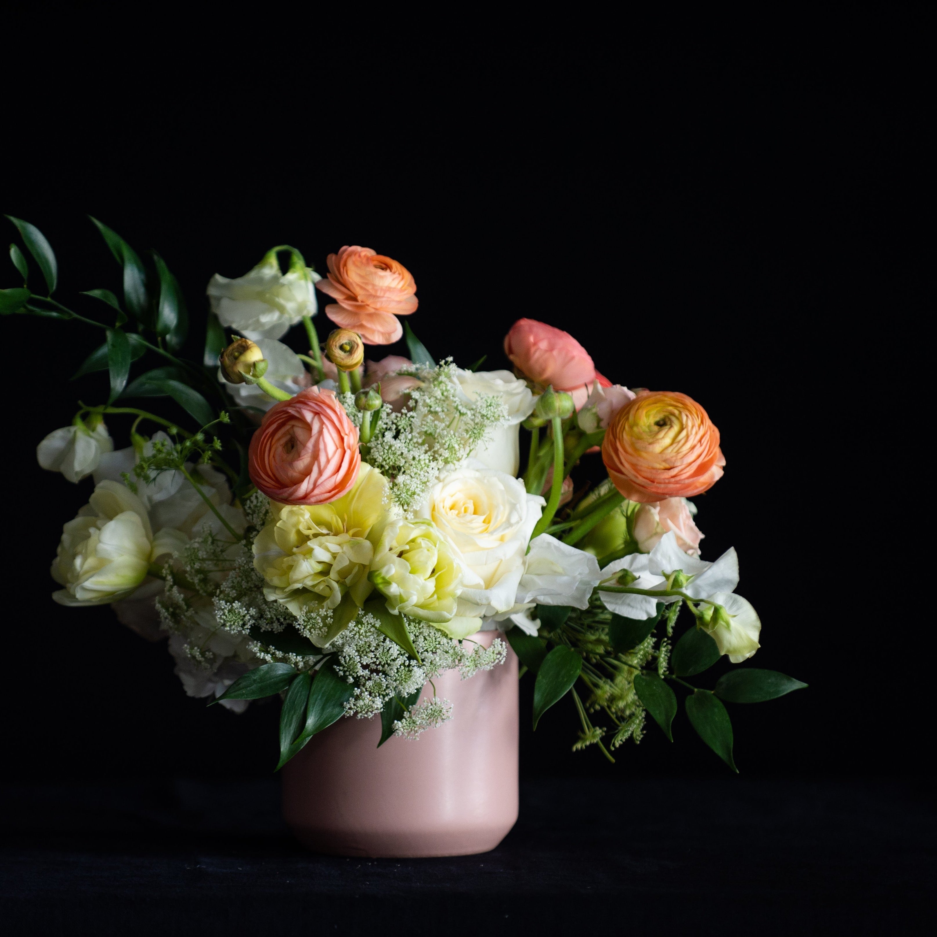 Mothers Day flowers in peach and white in a matte blush container