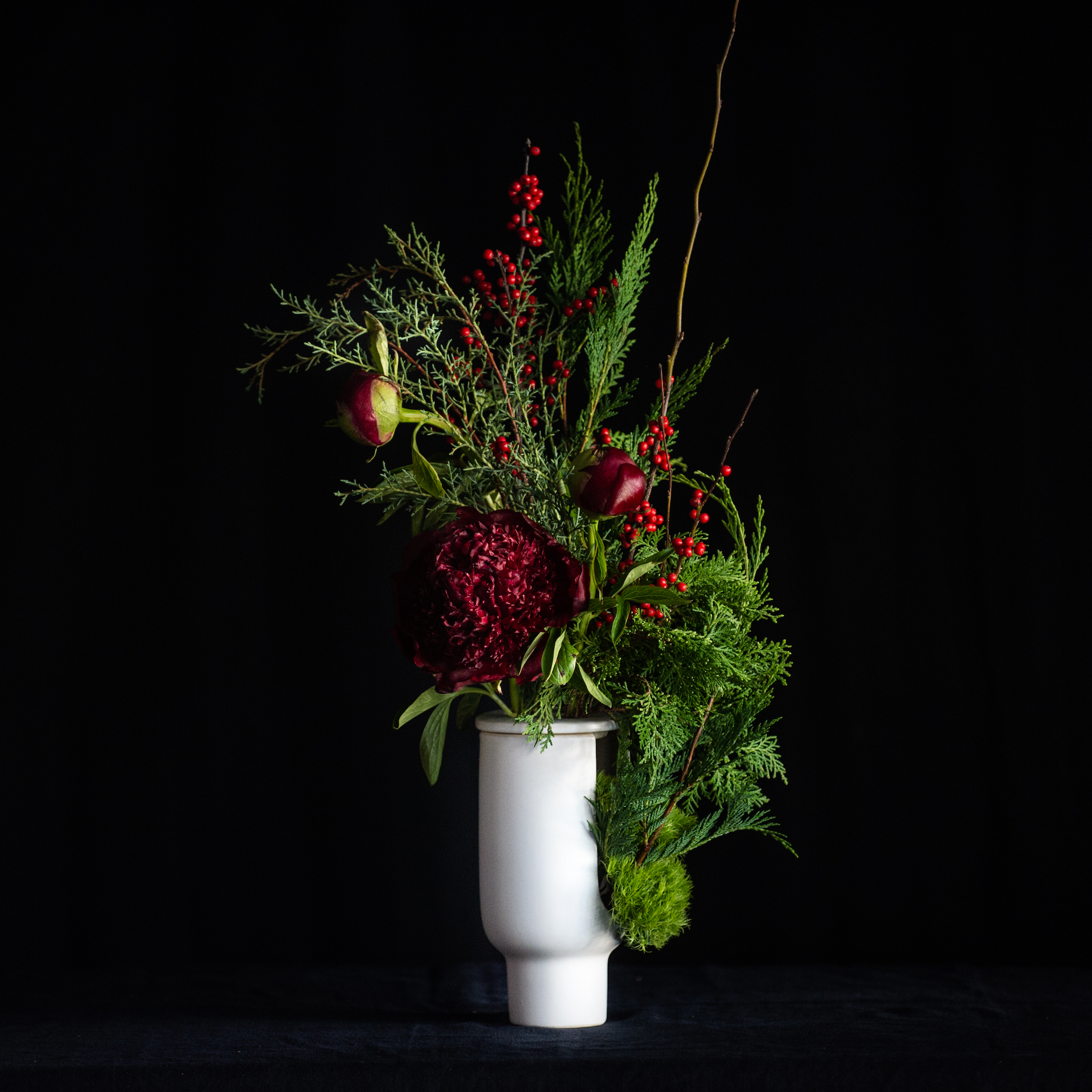 Peonies and holiday greens