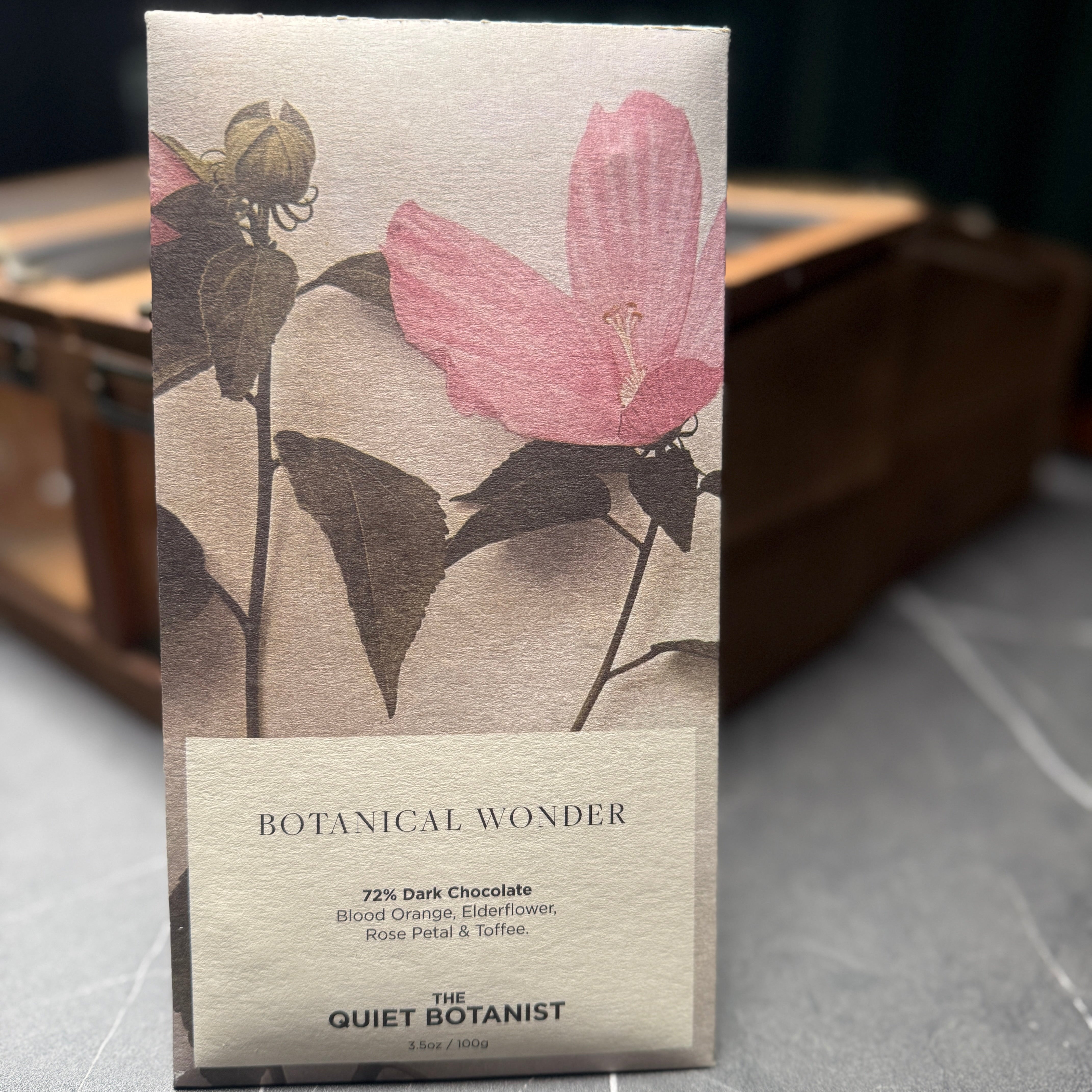 Artsan dark chocolate bar with rose petal, elderflower, blood orange, and toffee