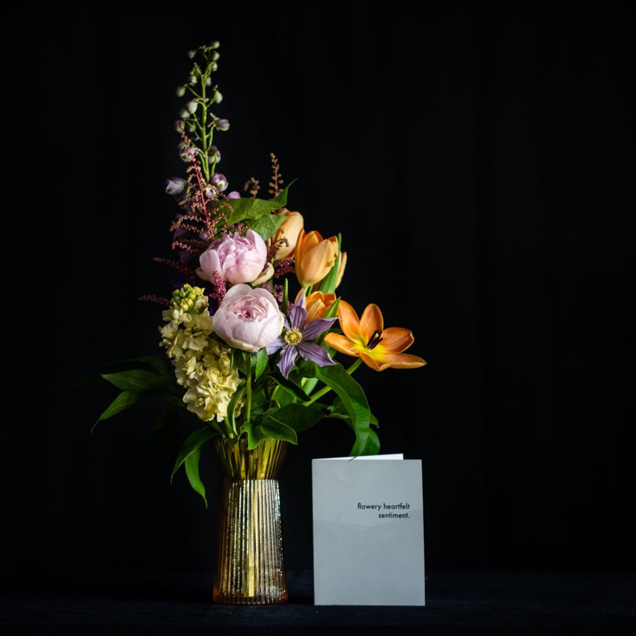 The perfect rose bud vase is filled with peonies and Spring stems
