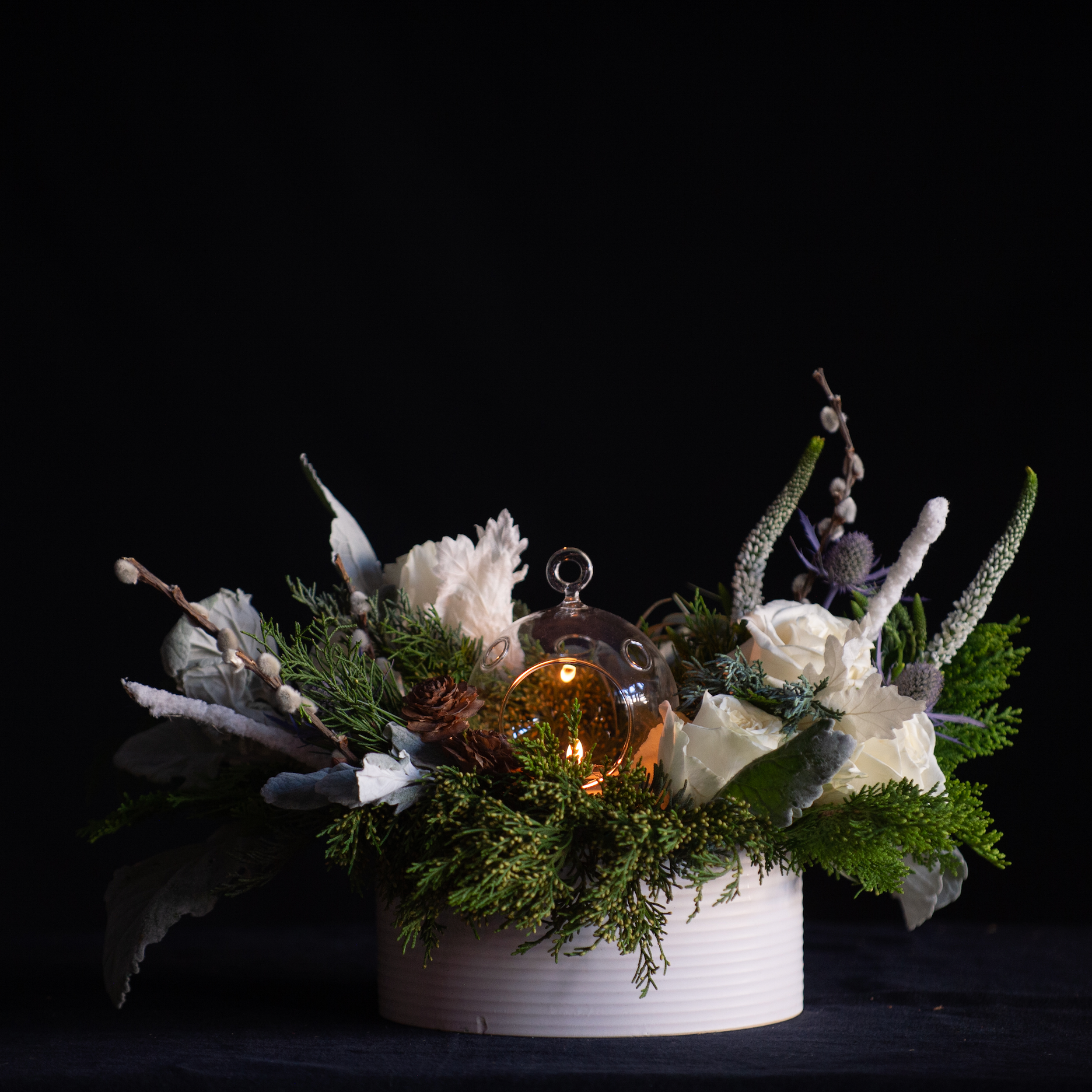 candlelit white holiday centerpiece 