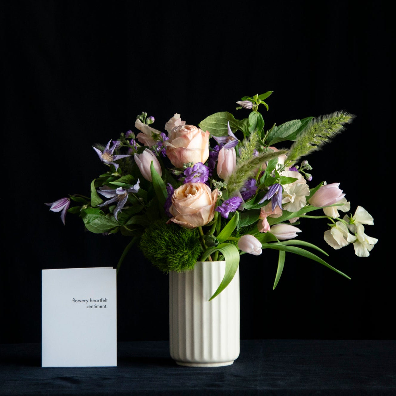 Spring design of garden roses, tulips, sweet peas in pastel tones
