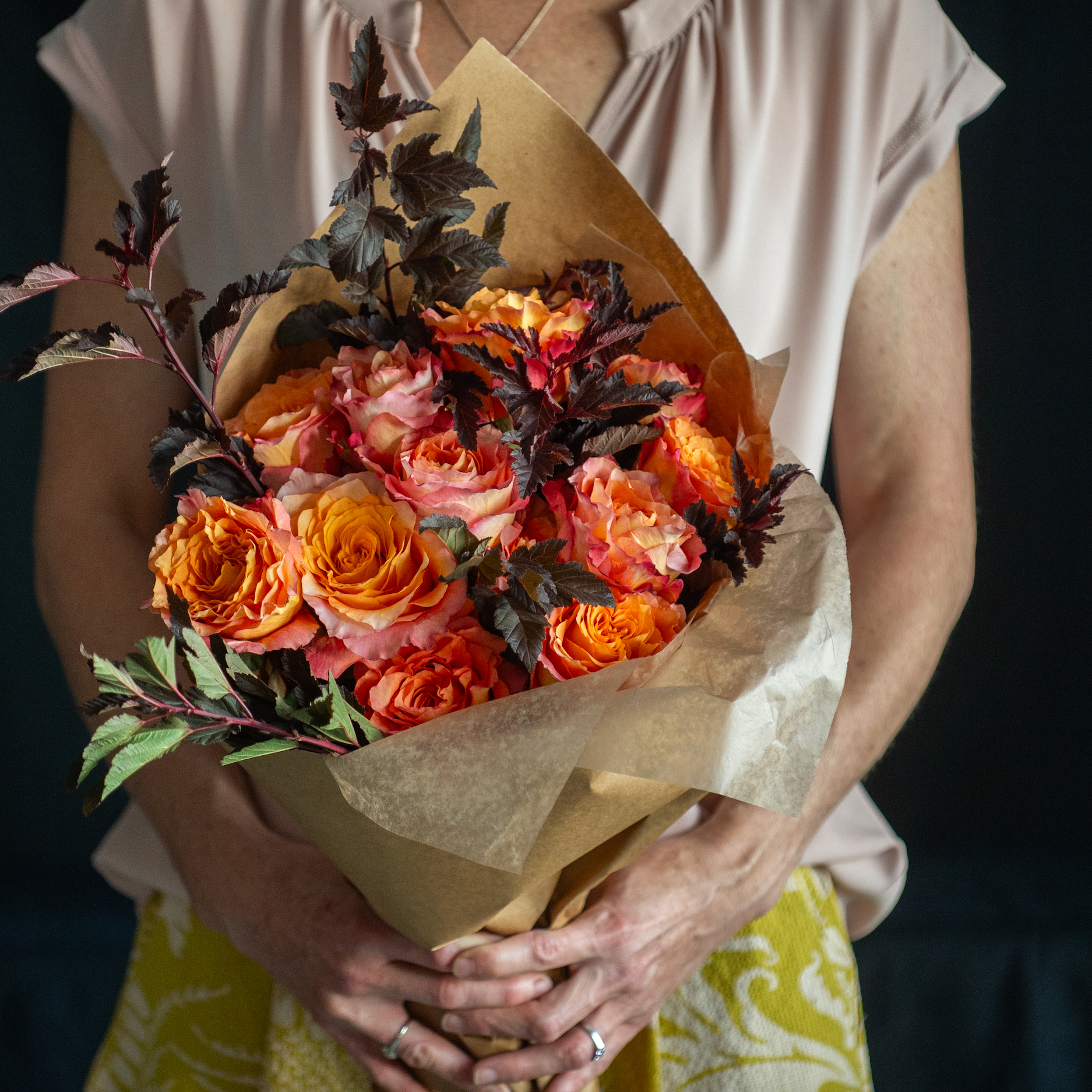 a dozen Fall roses with foliage