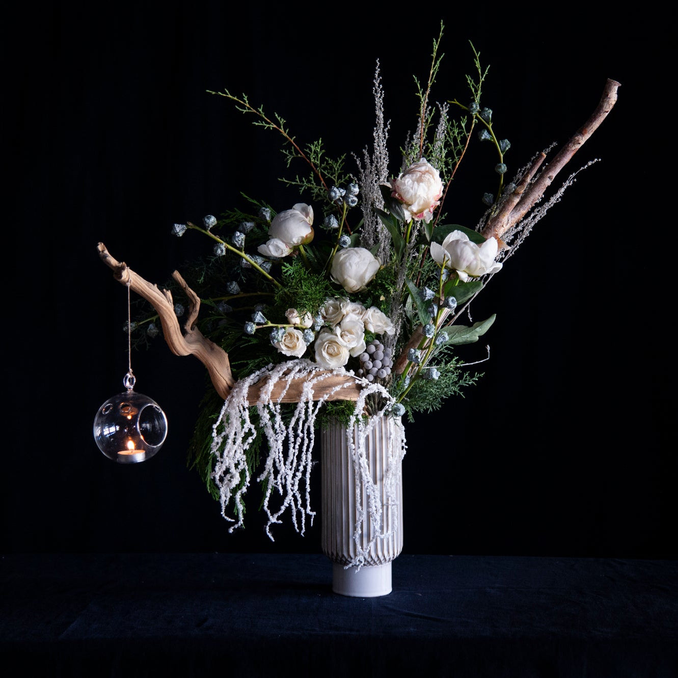 tall white holiday floral design