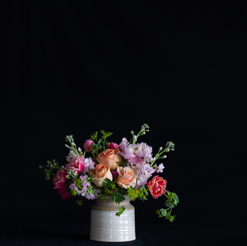 A pastel  floral design of roses, hydrangea, stock and tulips.