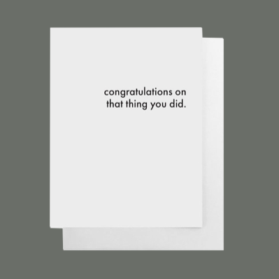 White greeting card with black text that says "congratulations not hat thing you did" blank on the inside for your message