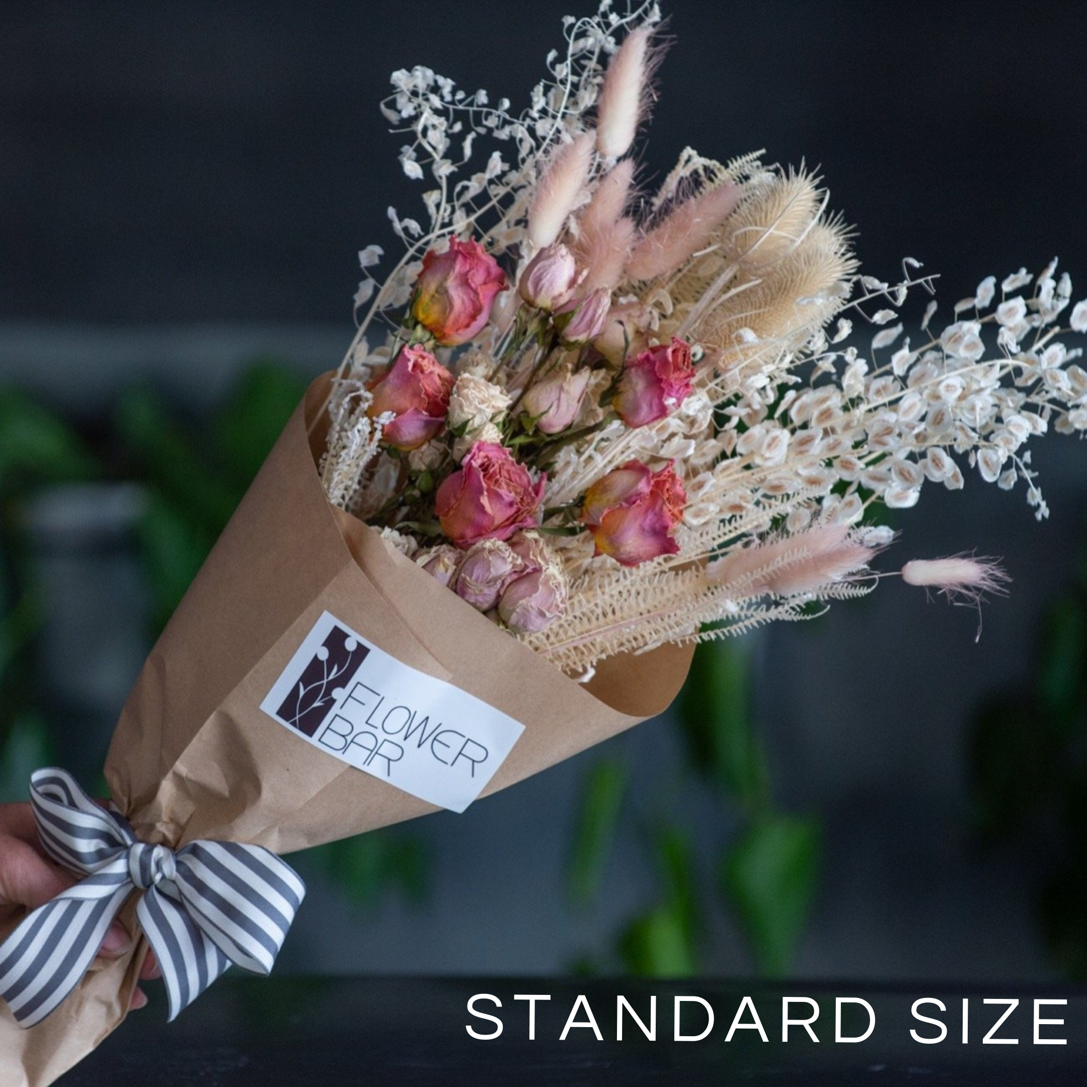 A wrapped bouquet of dried and preserved stems