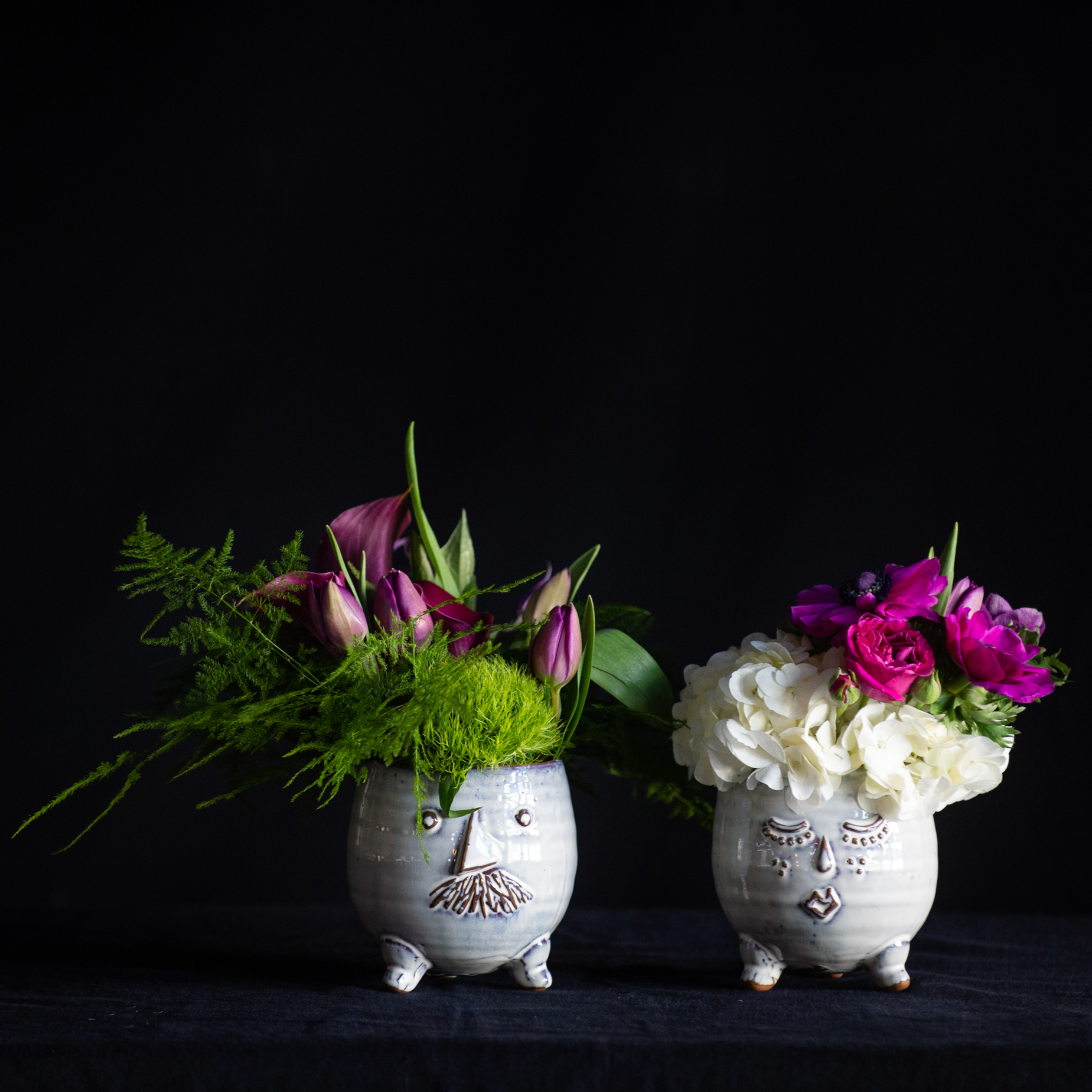 Mr. and Mrs. pots filled with seasonal florals.
