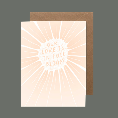 Standard greeting card that says, "our love is in full bloom" Blank on the inside 