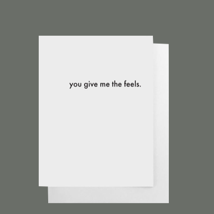 Standard white greeting card that says "you give me the feels." Blank on the inside 